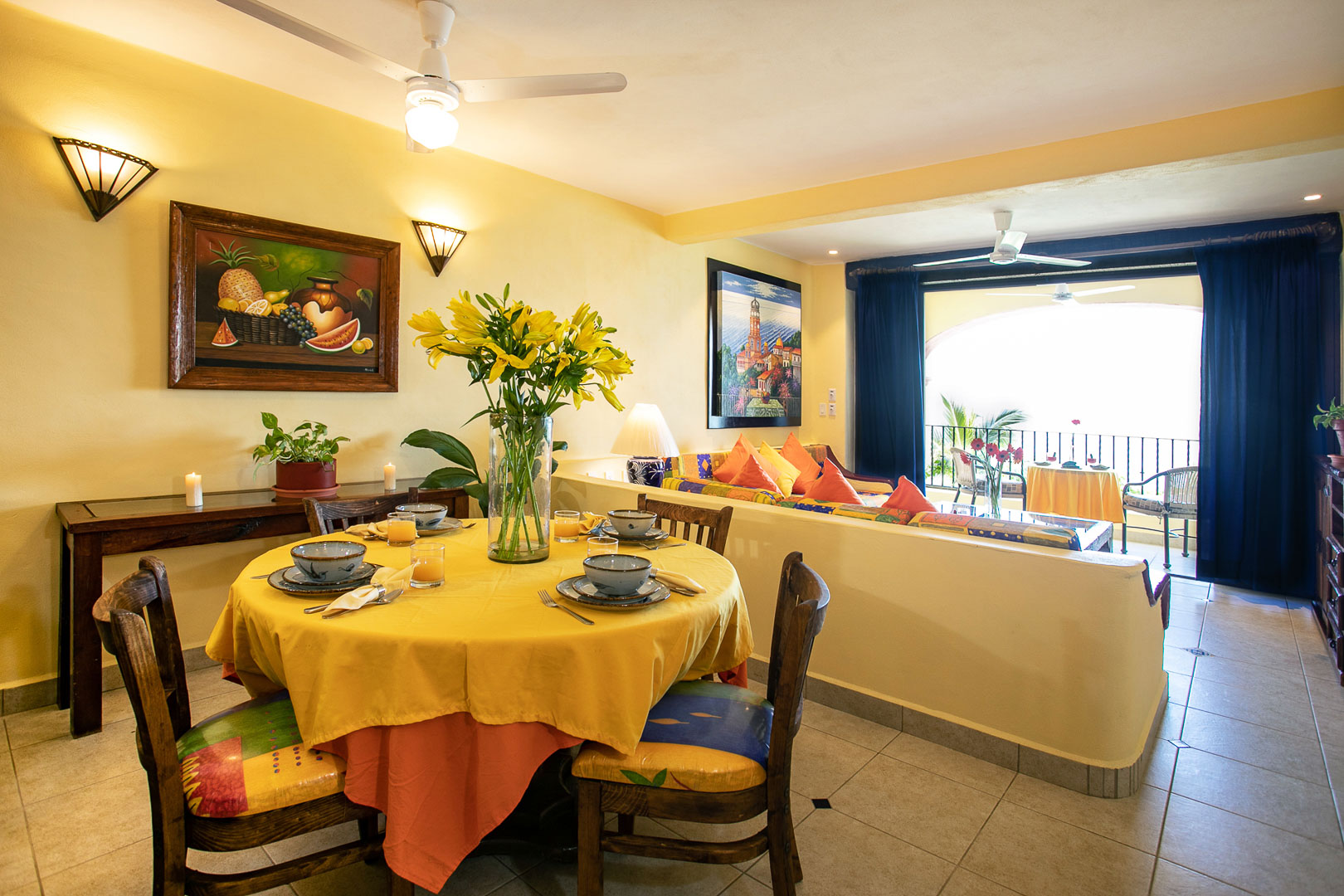 A colorful dining table and living room that faces the ocean view at TPI's Lindo Mar Resort in Puerto Vallarta, Mexico.